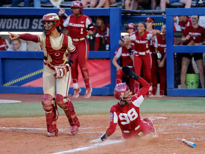 Oklahoma's Jordyn Bahl slides home to score during the sixth inning of Game 2 of the Women's College World Series.